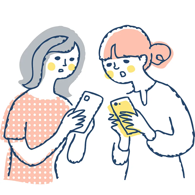 スマホを見ながら話しを聞き合う女性