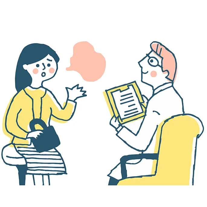 医師に説明をする女性